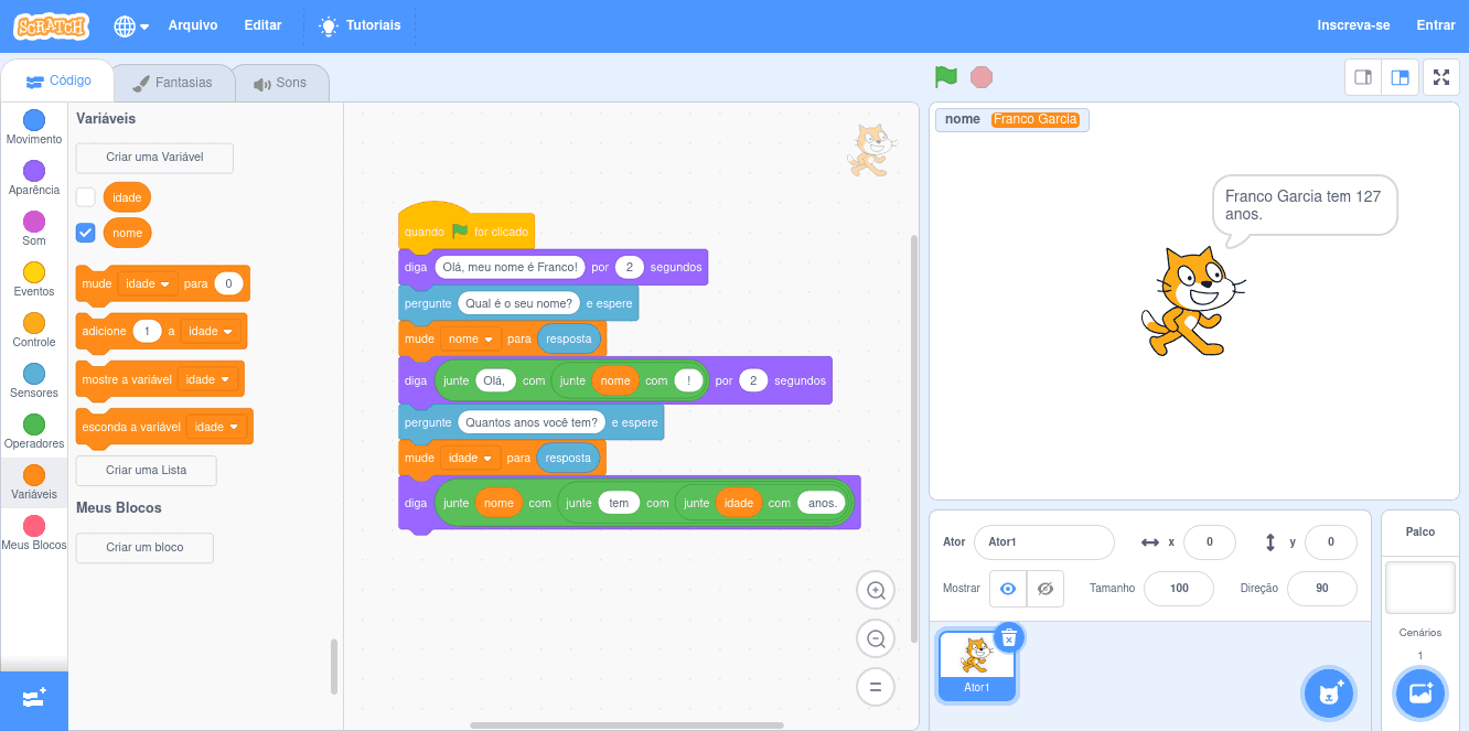 Exemplo de programação visual em Scratch com duas variáveis: uma do tipo cadeia de caracteres, outra do tipo inteiro.